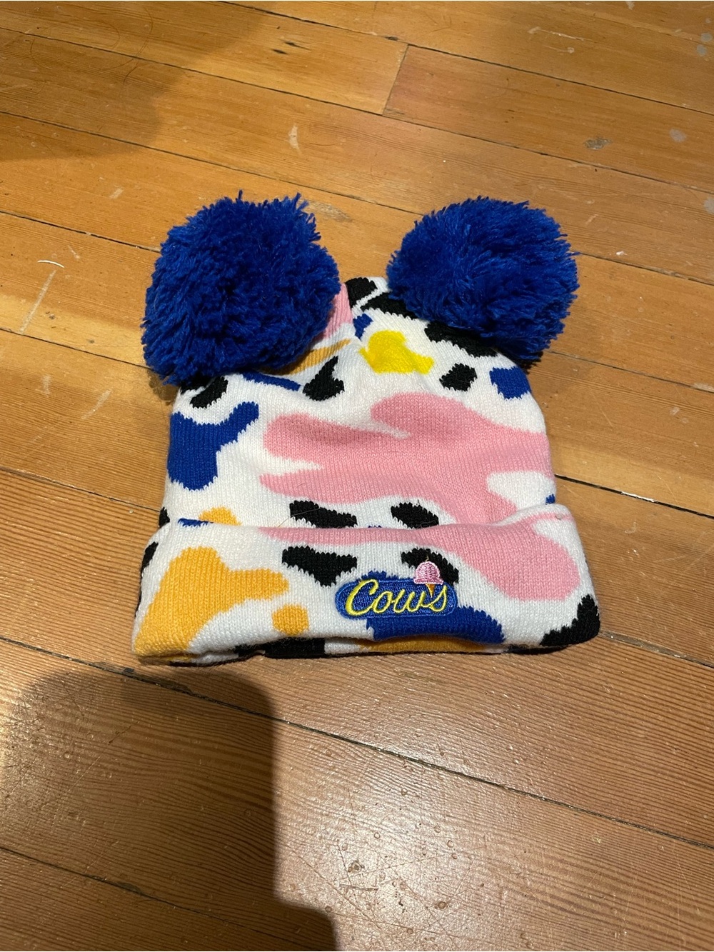 Colorful Pom Pom Beanie with 'Cows' Patch